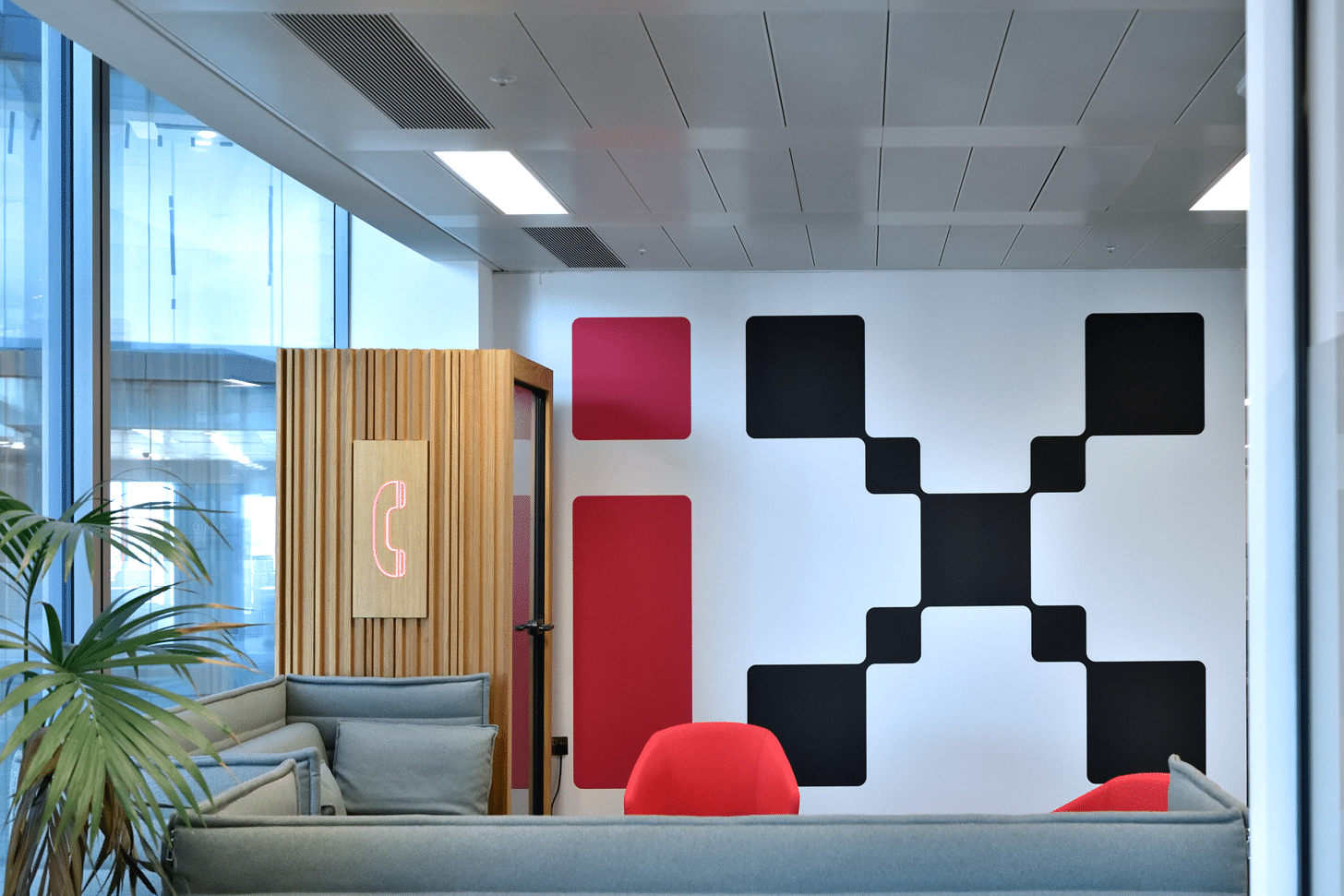 Image of the interior of the I-X Institute, featuring a large I-X logo backdrop